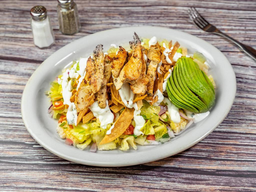 Chicken Mexican Salad · Romaine lettuce, onion, black beans, bell pepper, grilled corn, fried tortilla, cilantro, avocado, spiced sour cream, and house dressing.