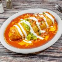 Special Mojado · Wet burrito. Any meat, rice, beans, topped with enchilada sauce, melted cheese, guacamole, s...
