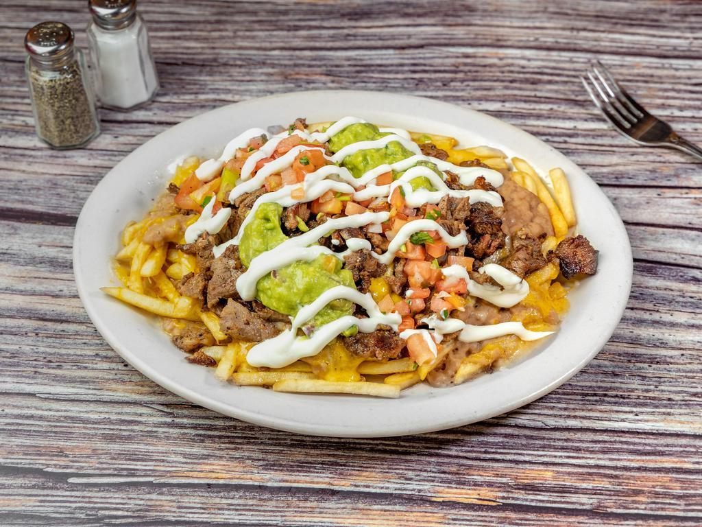 Bistec Ranchero Special Plate · Mexican style grilled beef steak, beans, rice, sour cream, guacamole, salad, and tortillas.