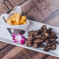 Carne de Res Frita · Fried beef meat.  Free House Salad