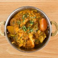 Sabji Daal · ‘Masoor Daal’ (lentils) cooked with turmeric, tomatoes, onions, roasted garlic and mixed veg...