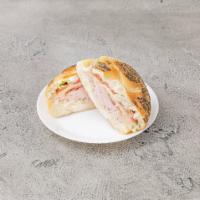 5. The Corbo Club on a Roll · Honey turkey, melted mozzarella, bacon, lettuce, tomato and mayo on a roll.
