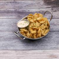 Bayou Pickle Chips · Thin sliced pickle chips soaked in buttermilk, lightly breaded, flash fried crispy and serve...