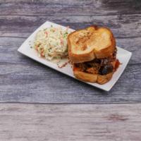 BBQ Sandwich · House slow smoked meat with 1 side and choice of toasted bread or a freshly baked bun.