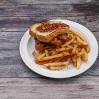 Bacon Grilled Cheese Burger · A fresh ground 1/2 pound Angus steak patty, with three strips of bacon and American cheese w...