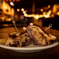 Reuben · Corned beef with our famous bacon sauerkraut, Swiss cheese, and house-made thousand island d...