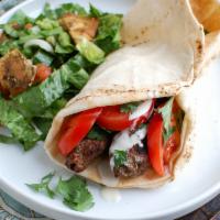 Grilled Meatball Sandwich · Grilled ground lamb and beef seasoned with Middle-Eastern seasonings with a side of rice, sa...