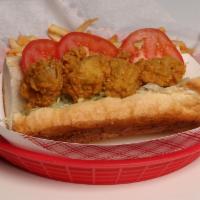 Oyster Po'Boy Sandwich · Po'boy include lettuce, tomato and our own house crafted honey jalapeno dressing.