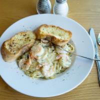 Prawn Fettuccine Alfredo · Large prawns sauteed with fresh garlic, finished in creamy Alfredo sauce, topped with Parmes...