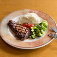 New York Steak · 8oz. New York steak topped with maison butter - served with mashed potatoes & vegetables.