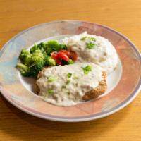 Chicken Fried Steak Dinner · Chicken fried steak topped with country style gravy -  served with mashed potatoes & vegetab...