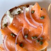 Smoked Salmon Toast · First Light Farms goat cheese, gravlox, red onion, and capers served on grilled table bread