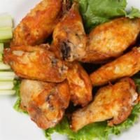 Chicken Wings Dinner · Tossed in spicy Sriracha or mild Louisiana sauce. Served with ranch dip, carrot, and celery ...