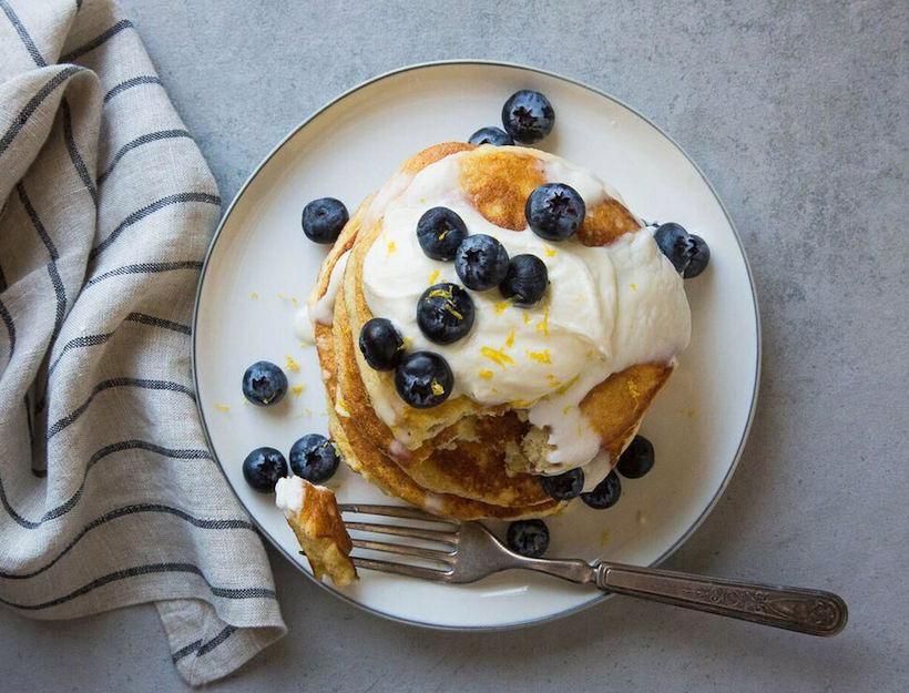 Blueberry Ricotta Lemon · Stack of Three Blueberry Pancakes, Topped With Ricotta Whipped Cream, Bursting with Fresh Blueberries, Drizzle with Lemon Sauce and Lemon Zest, Served with Maple Syrup