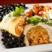 Chimichanga · Choice of chicken OR barbacoa, lettuce and pico de gallo, then crisped & covered with queso ...
