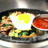 Hot Stone Bibimbap · A popular Korean rice dish with assorted vegetables. Served with choice of white or brown ri...