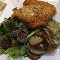 Chicken Alla Milanese · Pan-fried breaded chicken with balsamic drizzled mix greens and roasted potatoes.