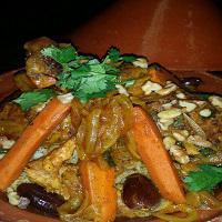 Walnut and Date Chicken Tagine · A delightful slow-cooked chicken with dates, carrots, caramelized onions, Moroccan spices, w...