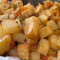 Papa a la mexicana · Potatoes cooked w/ onions, tomatoes, and peppers