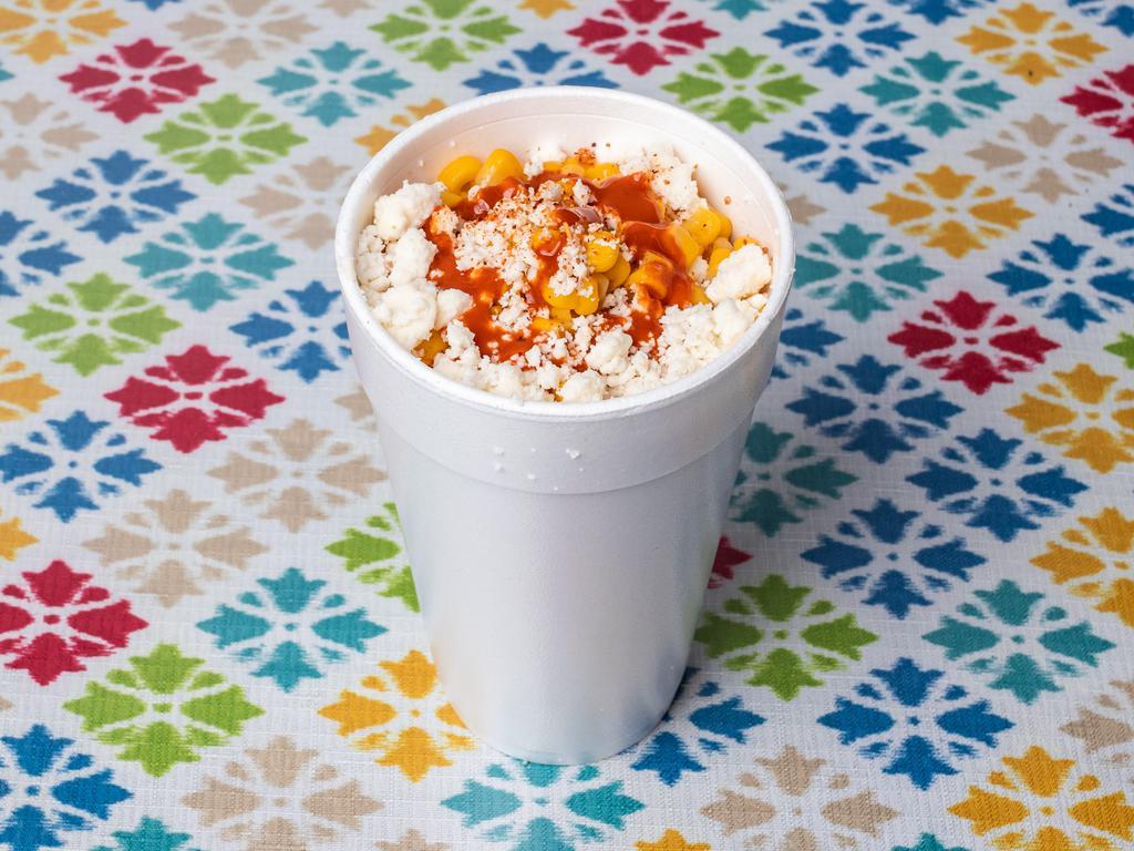 Elotes · Corn topped w/ sour cream, lime juice, queso fresco, and hot sauce 