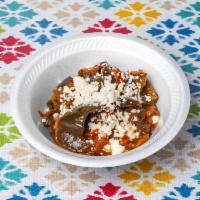 Rajas (Ancho Peppers)  · Sauteed ancho peppers w/ onions and tomatoes, topped w/ queso fresco 