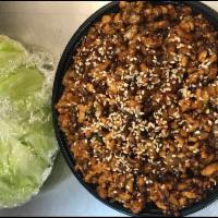 Chicken Lettuce Wraps · Stir fried chicken with water chestnut, scallion and includes lettuce. White meat.