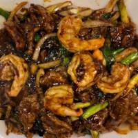 Sizzling Mongolian Beef and Shrimp · Stir fried beef and shrimp with scallion, onion in a brown sauce (sizzling). Hot and spicy.