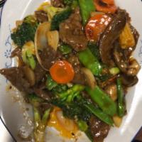Volcano Beef · Stir fried beef with broccoli, baby corn, mushroom, zucchini, bamboo shoot, snow pea, carrot...