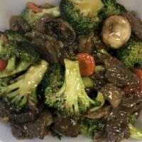 Beef Broccoli · Stir fried beef with carrot, mushroom broccoli in a brown sauce.