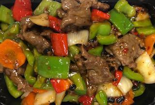 Pepper Beef · Stir fried beef with bell pepper, onion in a black pepper sauce. Hot and spicy.