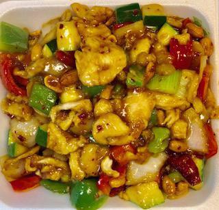 Kung Pao Chicken · Stir fried chicken with bell pepper, onion, zucchini, water chestnut, peanut in a garlic brown sauce. White meat. Hot and spicy.