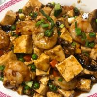 Ma Po Tofu Shrimp · Stir fried shrimp and tofu with carrot and peas in a spicy brown sauce. Hot and spicy.