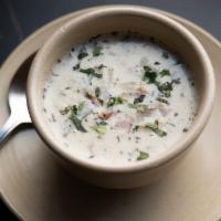 Cup of Clam Chowder · New England Style clam chowder, smoked bacon, red potatoes.