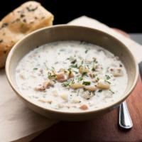 Bowl of Clam Chowder · New England Style clam chowder, smoked bacon, red potatoes.  Bowl served with herb focaccia.