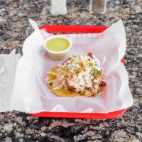 FISH TACO · BEER BATTERED DEEP FRIED TILAPIA TOPPED WITH LETTUCE AND BAJA SAUCE. 