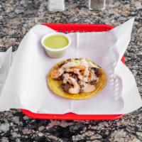 SURF ‘N’ TURF TACOS · SHRIMP AND STEAK TOPPED WITH AVOCADO AND BAJA SAUCE.