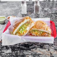 TORTAS  · MEXICAN SANDWICH- STUFFED WITH FRESH GUACAMOLE, LETTUCE, TOMATOES, CHEESE, BEANS AND YOUR CH...