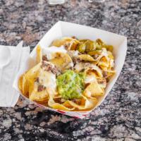 NACHOS · NACHO CHIPS- TOPPED WITH QUESO AND YOUR CHOICE OF MEAT. SIDE OF SOUR CREAM, GUACAMOLE AND JA...