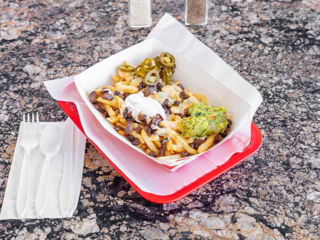ASADA FRIES  · FRIES TOPPED WITH QUESO, YOUR CHOICE OF MEAT AND SIDE OF GUACAMOLE, SOUR CREAM AND JALAPEÑOS.