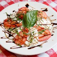 Insalata Caprese · Slices of fresh mozzarella, Roma tomatoes, and fresh basil drizzled with extra virgin olive ...