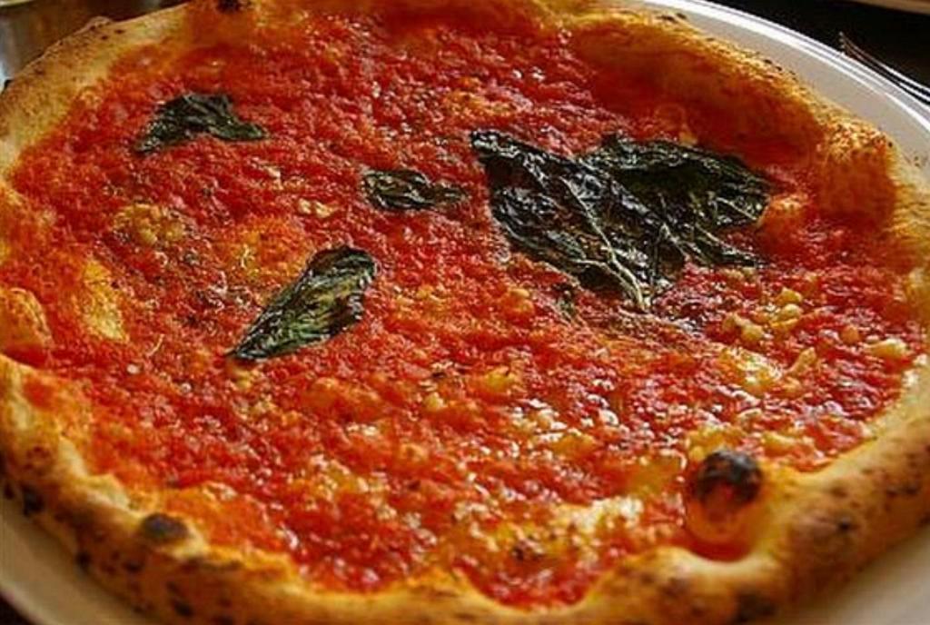 Marinara Pizza · Extra tomato sauce, spices and spicy olive oil.