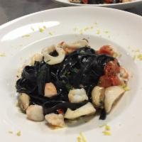 Tagliolini neri ai Frutti di Mare · Homemade fresh squid ink  tagliolini- garlic - shrimp - sea scallops - clams - mussels - cal...