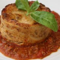 Il Timballo (Homemade lasagna) · Homemade layers of wide ribbon pasta, bechamel, beef tomato sauce, buffalo mozzarella cheese...