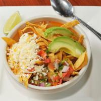 Tortilla Soup · Chicken broth with shredded chicken, rice, pico de gallo and cheese. Topped with tortilla ch...