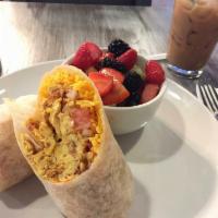Veggie Breakfast Burrito · Scrambled eggs, cheddar, potato, mushroom, onion, bell pepper and pico de gallo. Served with...