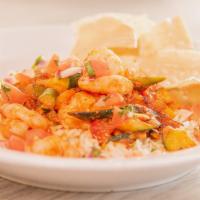 Grilled Shrimp Rice Bowl  · grilled shrimp, fajita veggies, guacamole, rice served with pico de gallo and tortilla chips.