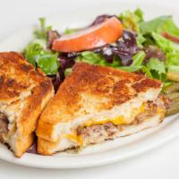 Patty Melt · 1/2 lb. usda choice, Swiss, grilled onion, and dijon served on pain de mie. Served with baby...