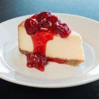 Plain Cheesecake · Rich chilled cheesecake topped with fresh strawberries and syrup.