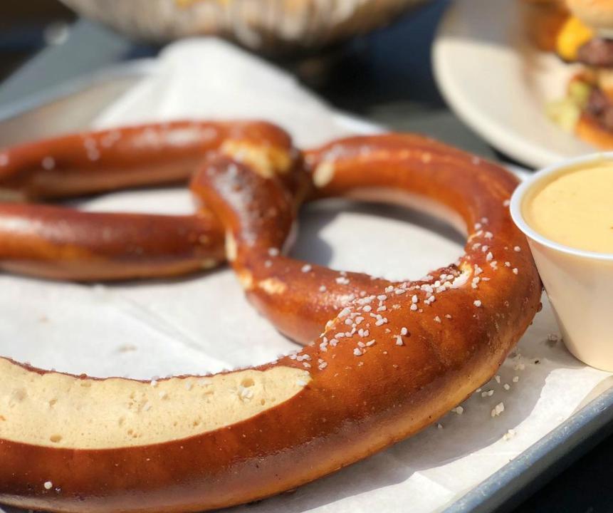 Soft Pretzel · A warm soft jumbo pretzel lightly salted and baked served with Mo’s Zesty 4-cheese sauce & honey mustard.