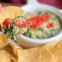 Spinach Dip · Creamy mixture of spinach, artichoke, roasted garlic and Parmesan cheese. Topped with diced ...